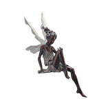 Hjemix | Statue av sittende fe i hagen