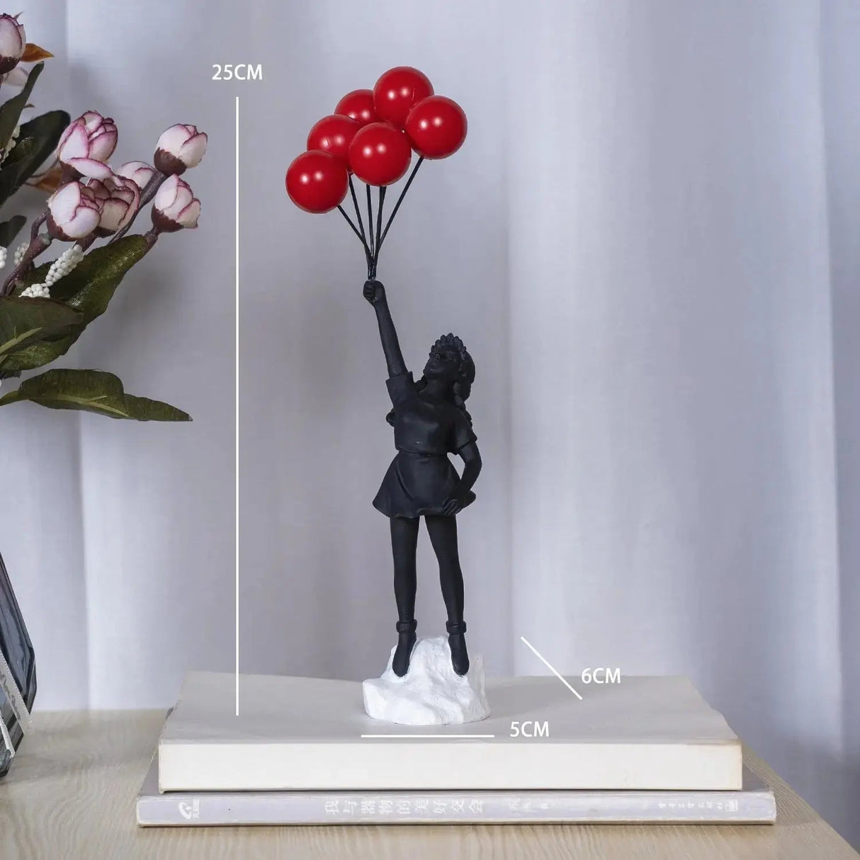Hjemix | Banksy flygende ballongjente statue