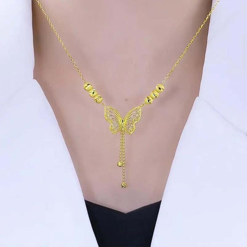 Hjemix | Halskjede med gullfarget sommerfugl med dusker