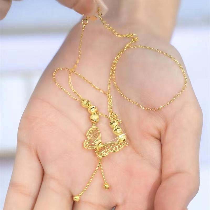 Hjemix | Halskjede med gullfarget sommerfugl med dusker