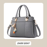 Hjemix | Elegant dameveske med dusk-anheng