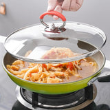 Hjemix | Silikongryteklokke med anti-sprutknott som holder håndtaket