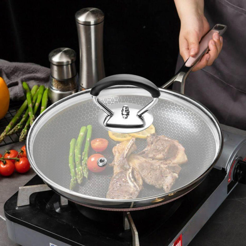 Hjemix | Silikongryteklokke med anti-sprutknott som holder håndtaket