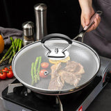 Hjemix | Silikongryteklokke med anti-sprutknott som holder håndtaket